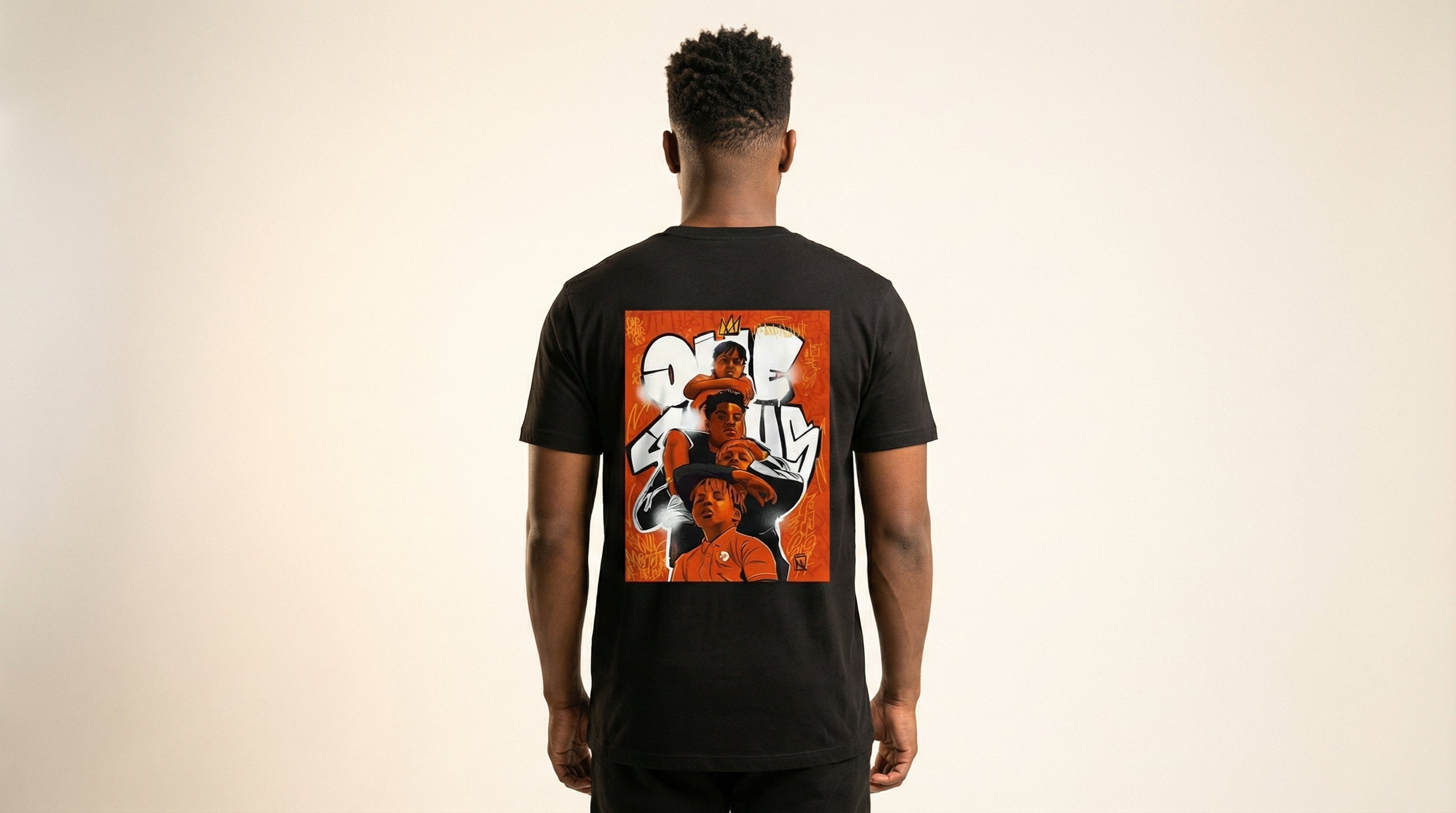 Catalog man wearing a black t-shirt with a colorful graphic on the back against a beige background