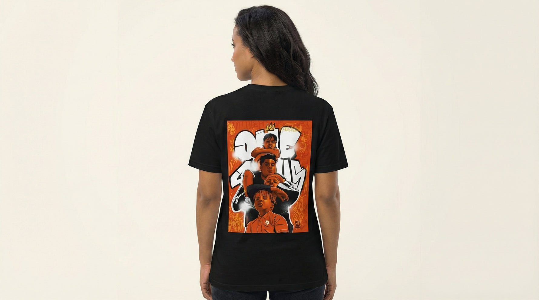 Catalog woman wearing a black t-shirt with a colorful graphic on the back against a beige background