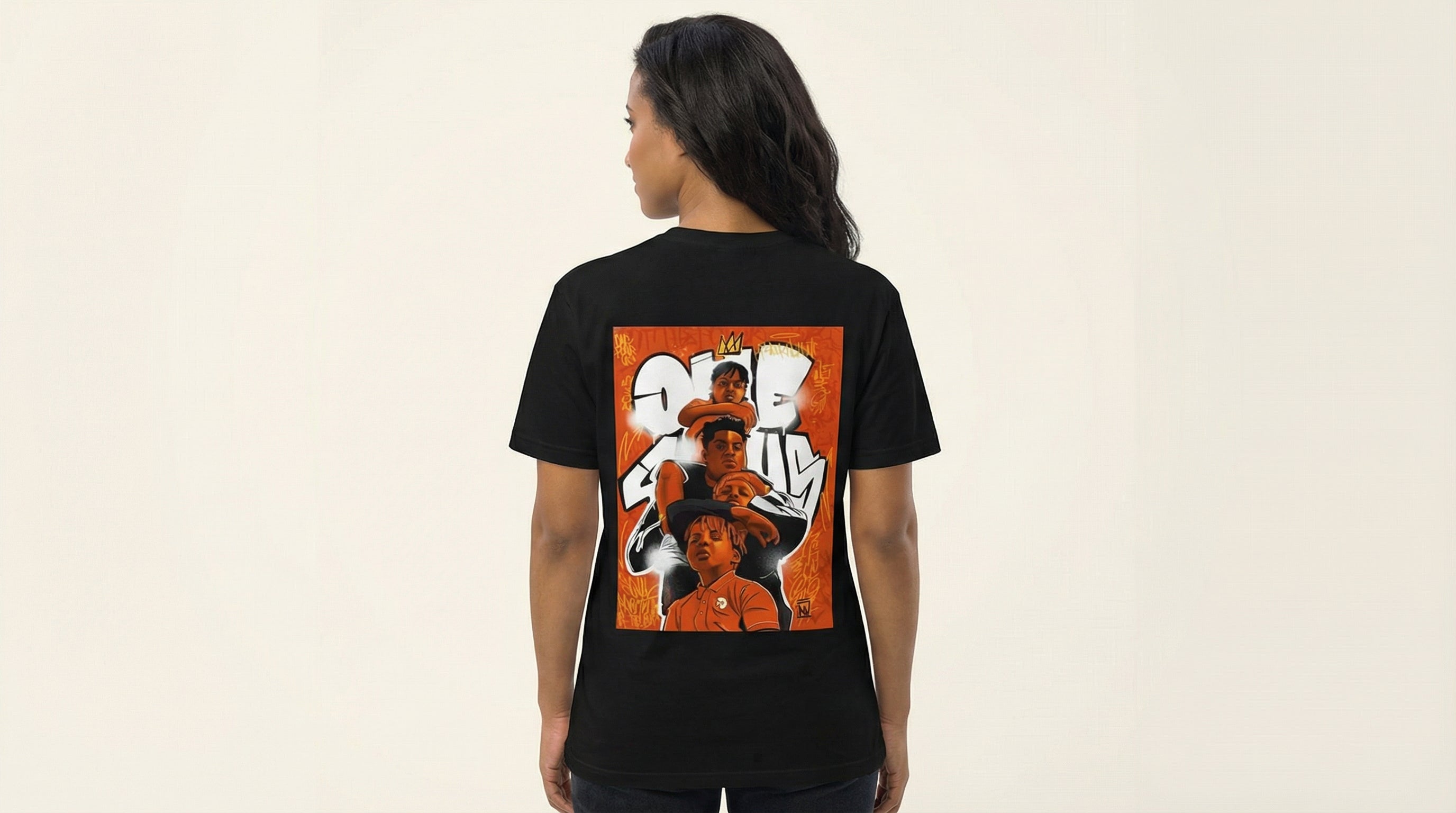 Catalog woman wearing a black t-shirt with a colorful graphic on the back against a beige background