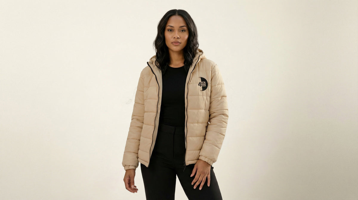 Catalog woman wearing a beige puffer jacket with a brand logo on a beige background