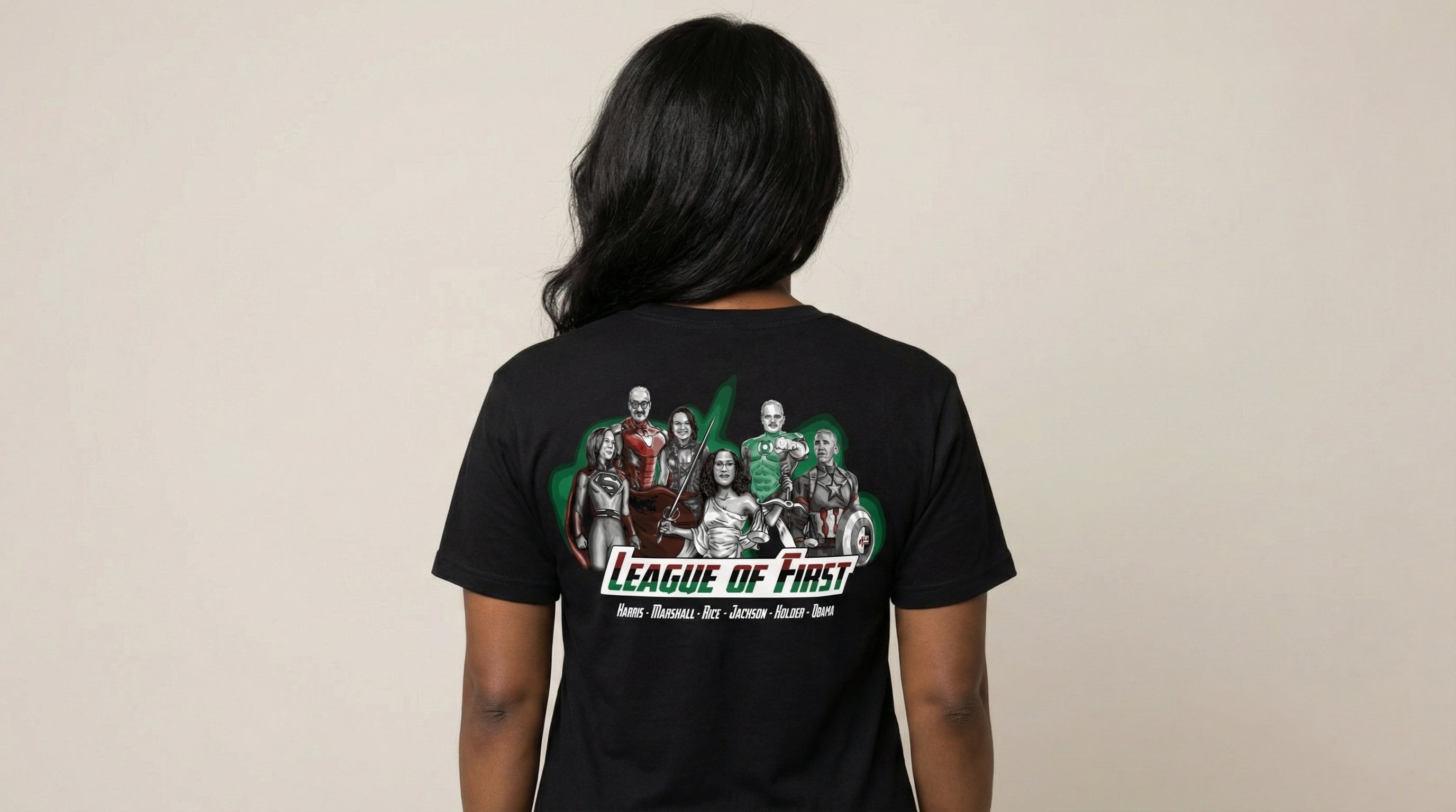 Catalog woman wearing a black t-shirt with 'League of First' graphic design on the back.