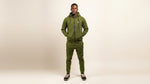 Catalog man wearing a green tracksuit on a white background