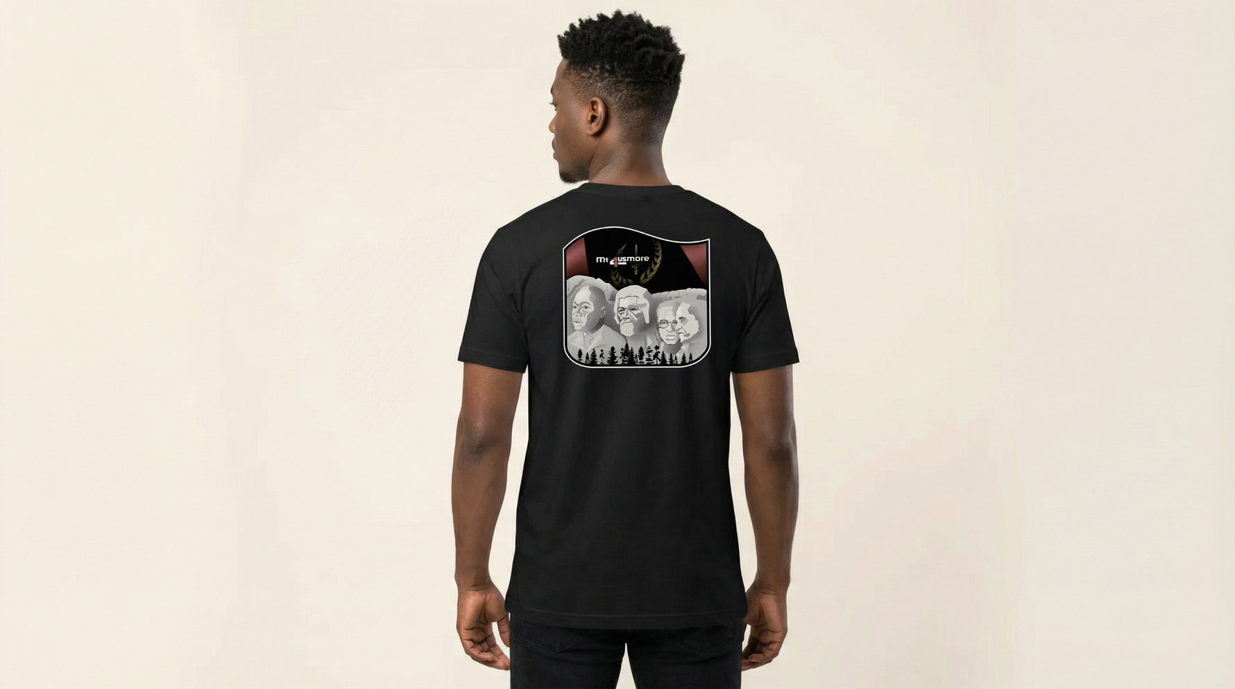 Catalog man wearing a black t-shirt with a graphic design on the back against a beige background