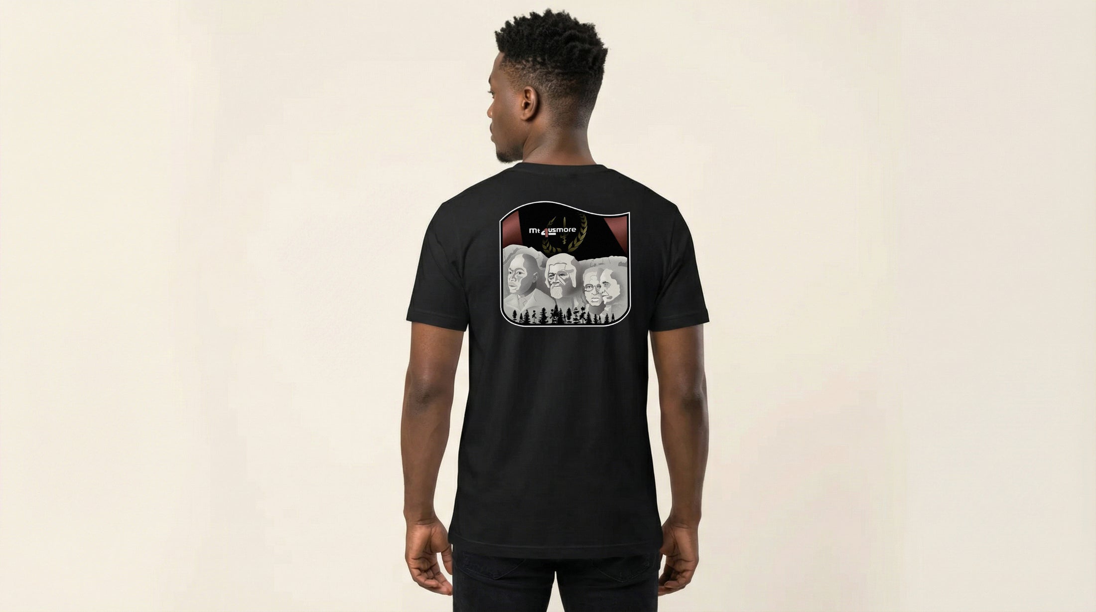 Catalog man wearing a black t-shirt with a graphic design on the back against a beige background