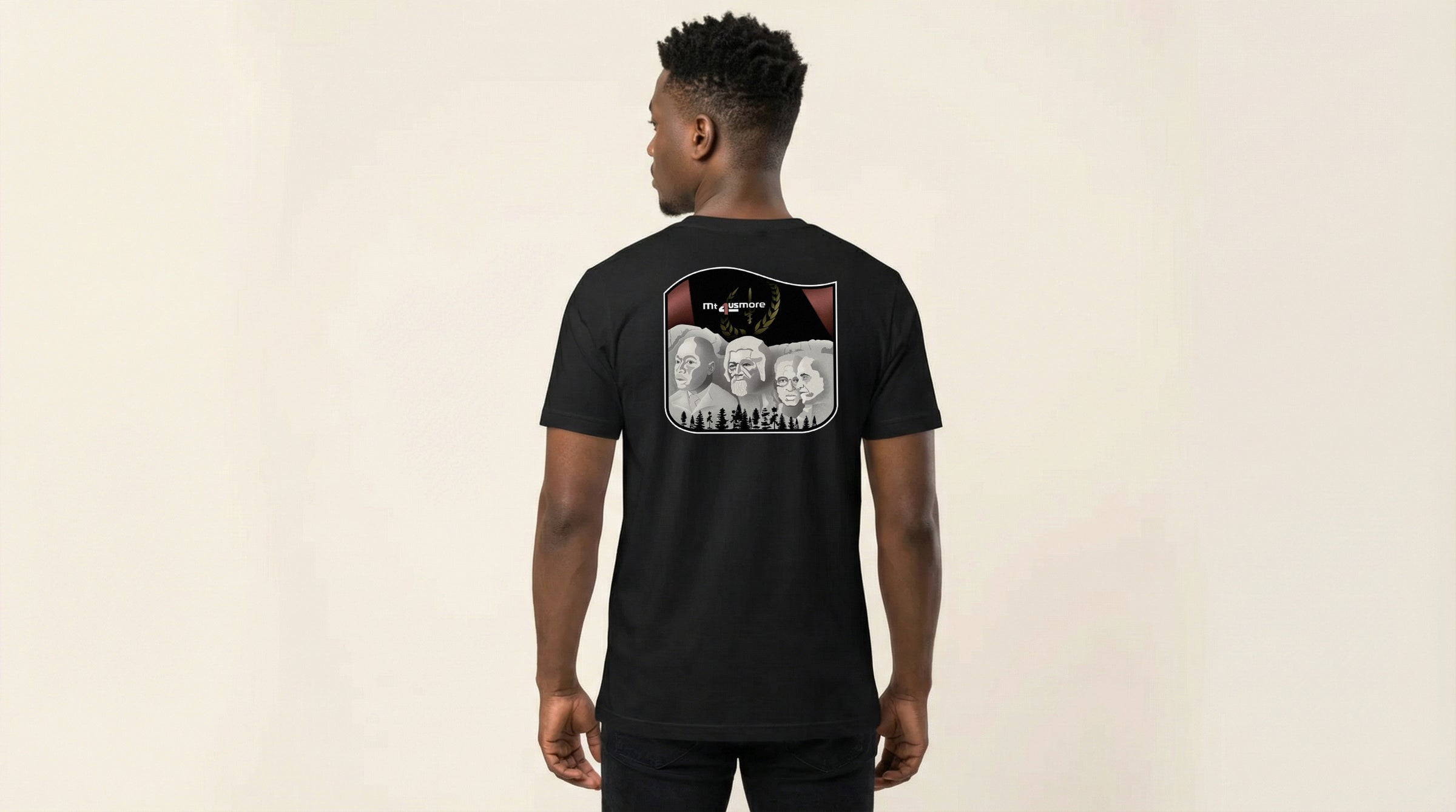 Catalog man wearing a black t-shirt with a graphic design on the back against a beige background